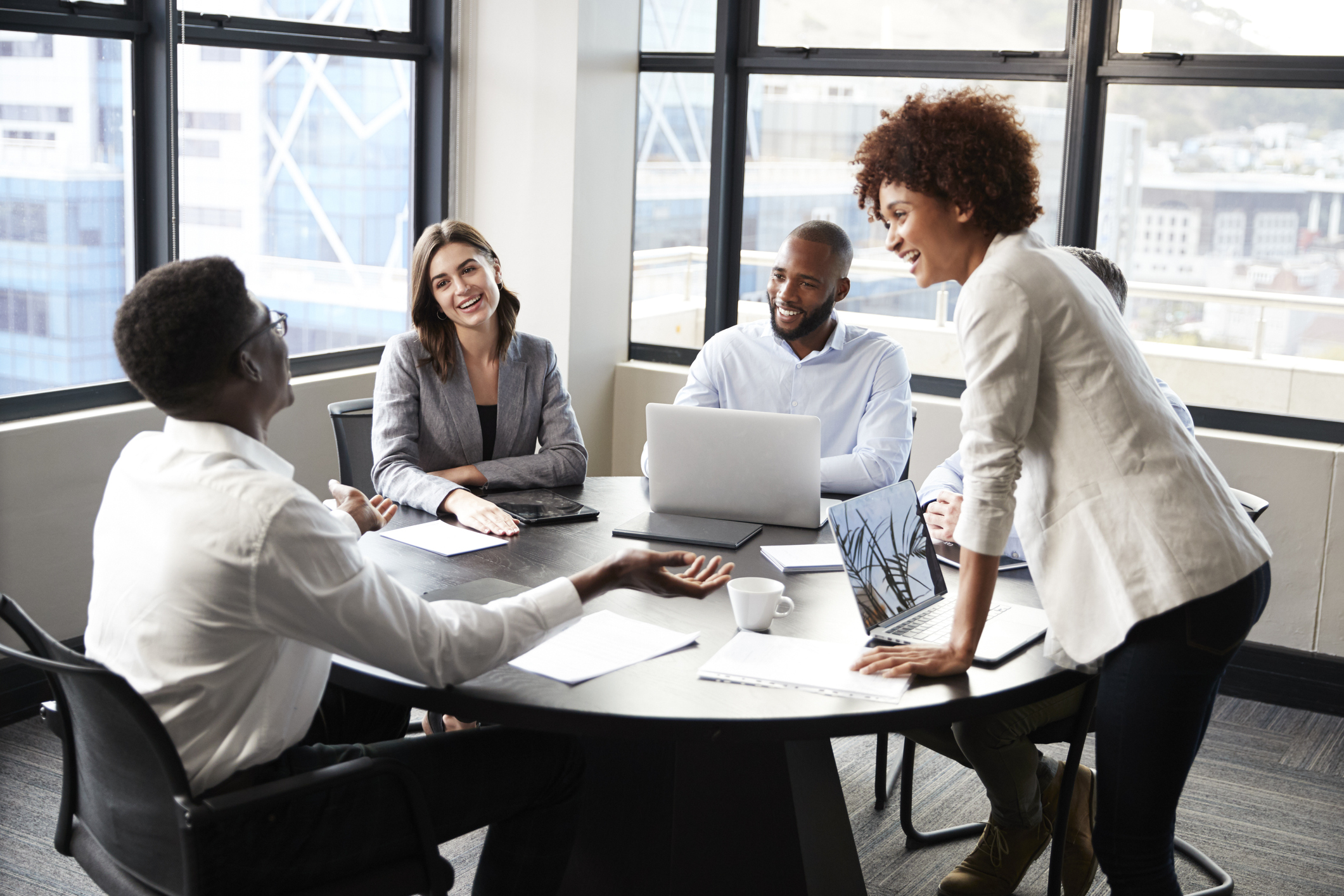 Photo of people gathered for a business meeting.