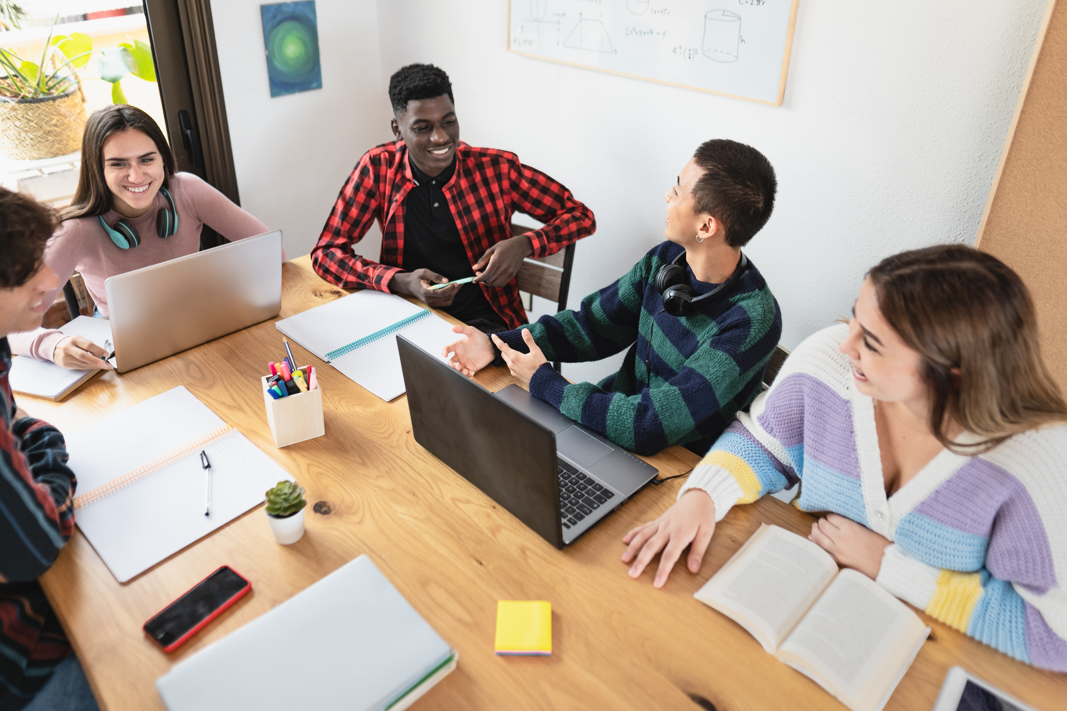 Photo of a group of students studying together at a table.