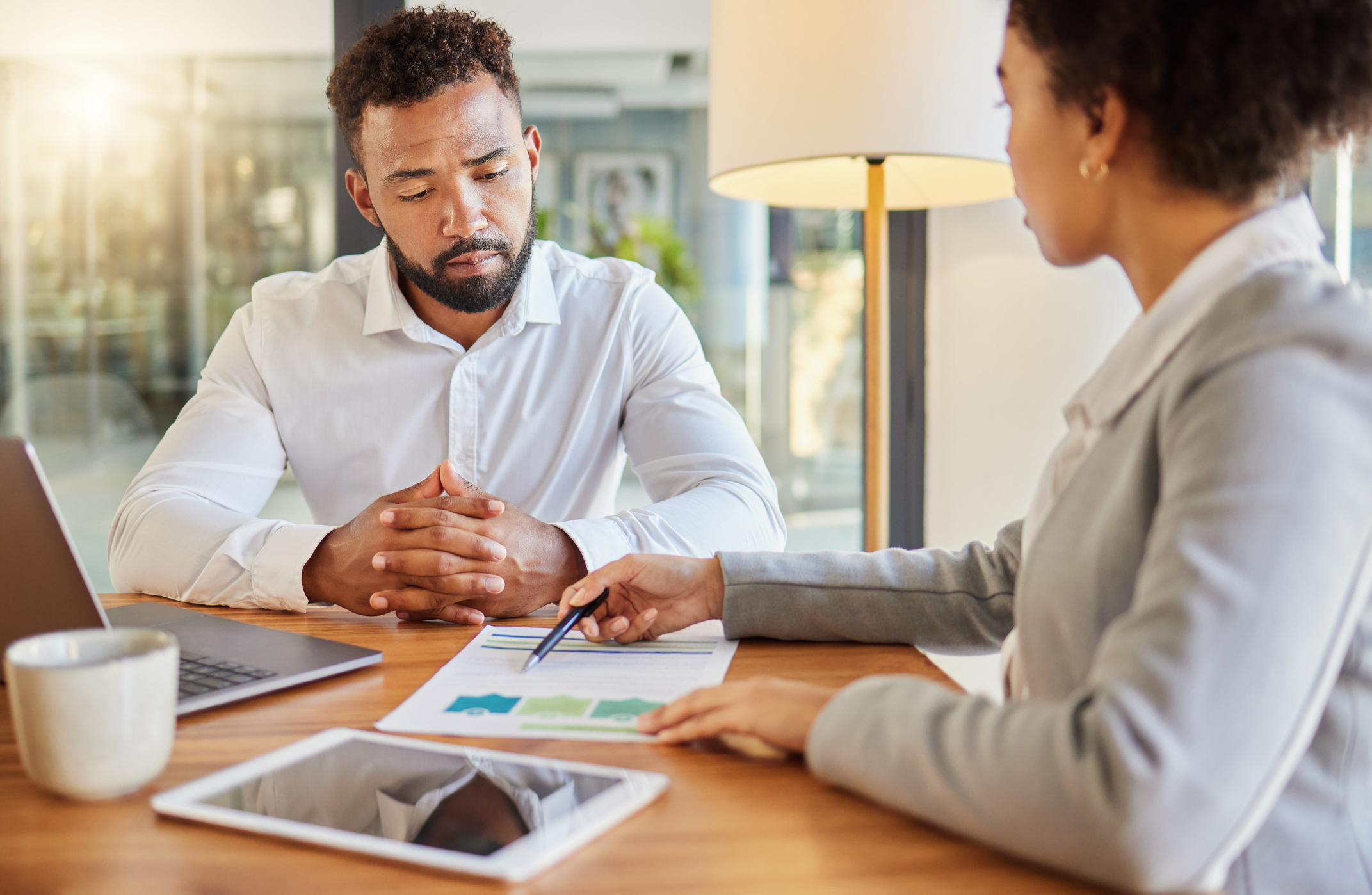 Photo of a female finance advisor in a meeting with a man