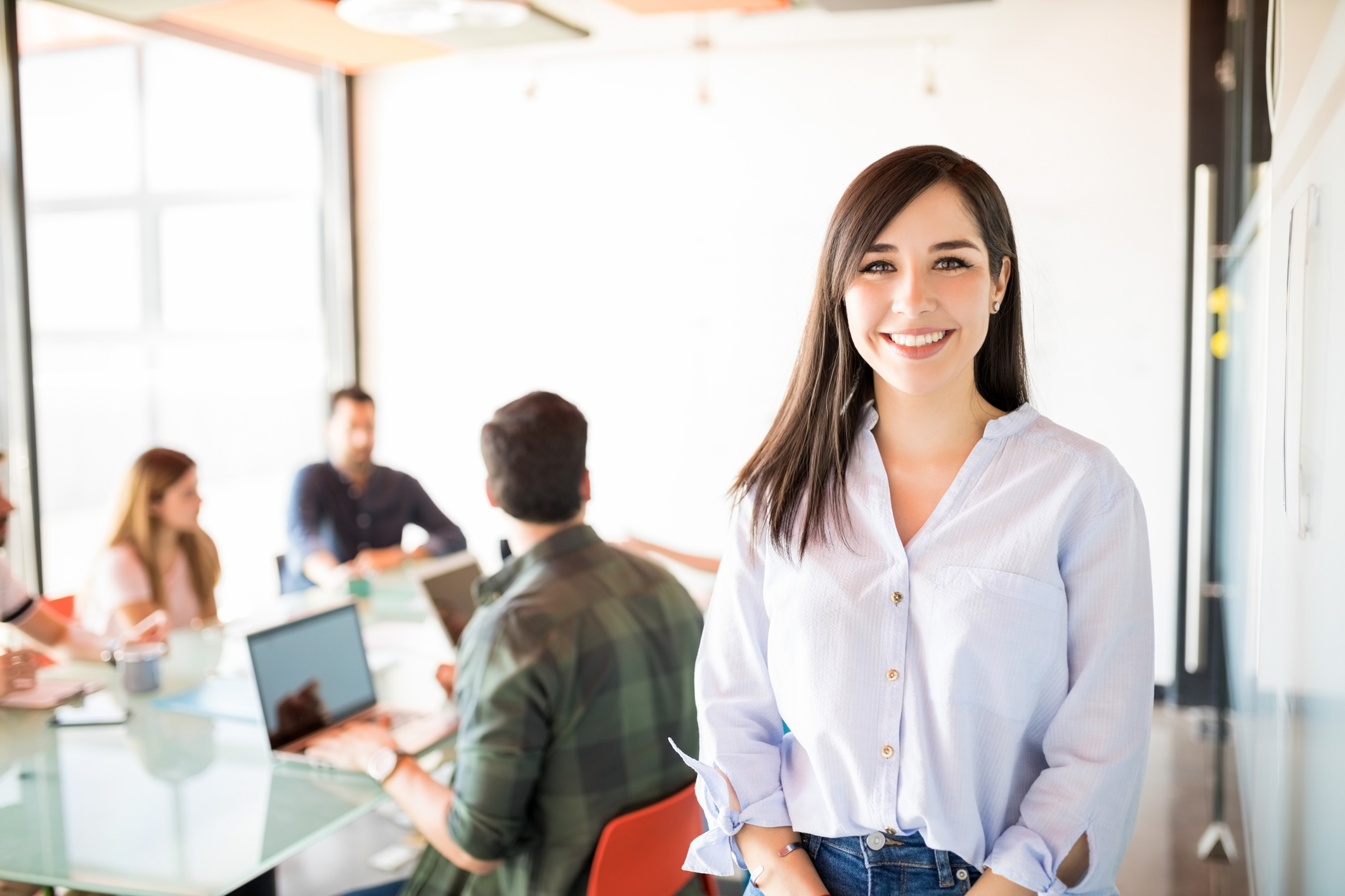 GettyImages-992892770 Photo of young businesswoman in casual clothes in modern meeting room