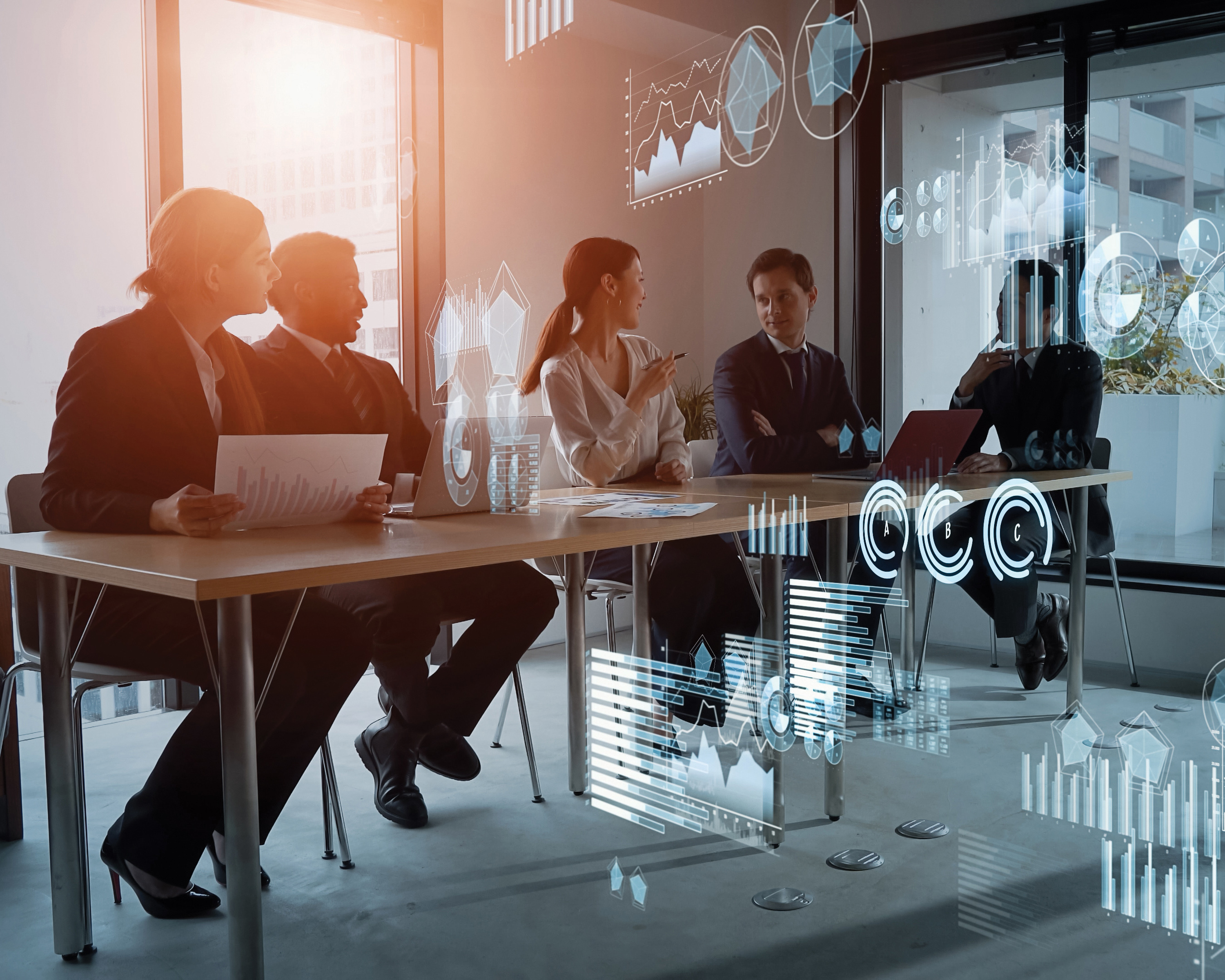 photo of people in a business meeting with financial charts