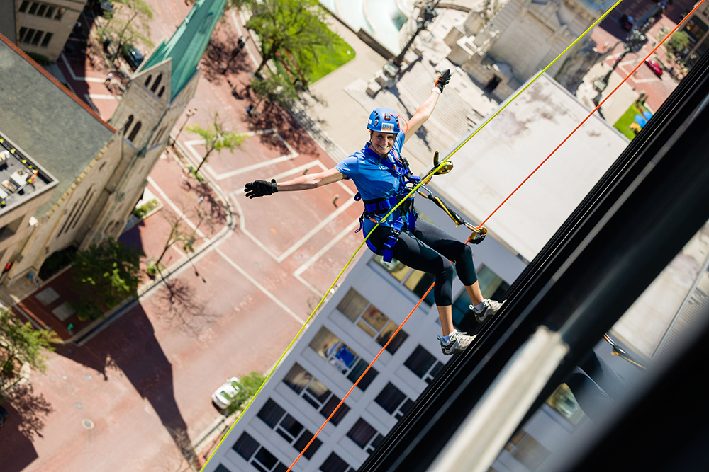 Photo of Mandy Parris scaling a 23-story building in downtown Indianapolis