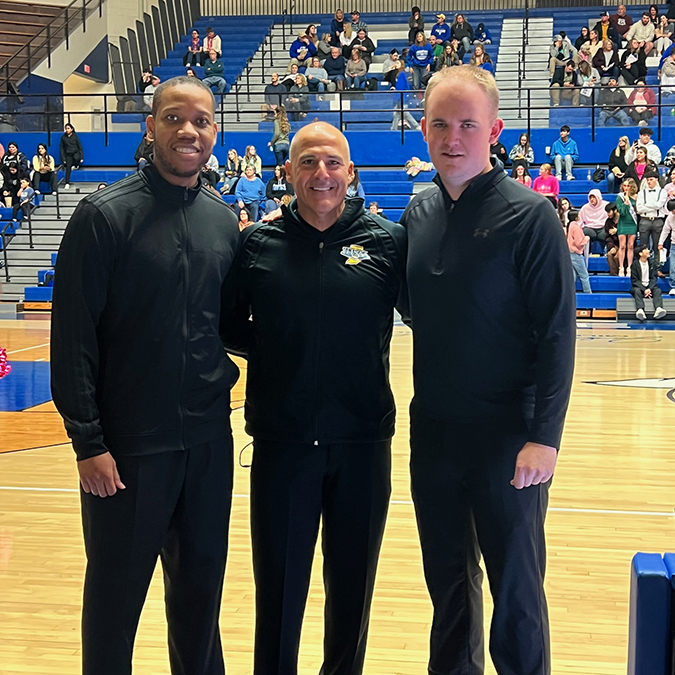 Photo of Brandon and fellow referees before tip-off at Frankfort High School’s varsity basketball game