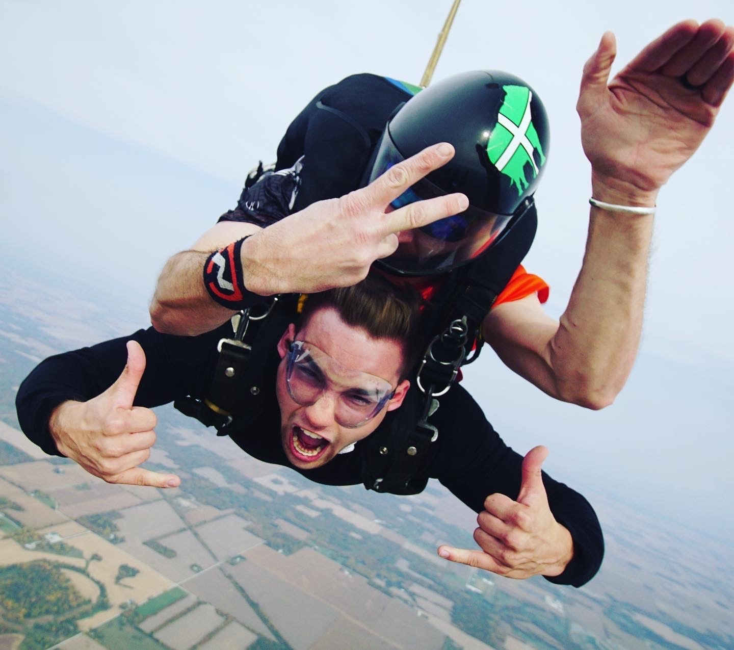 Photo of Michael skydiving. Michael plans to get his license after doing 10 skydiving jumps so he can jump on his own.