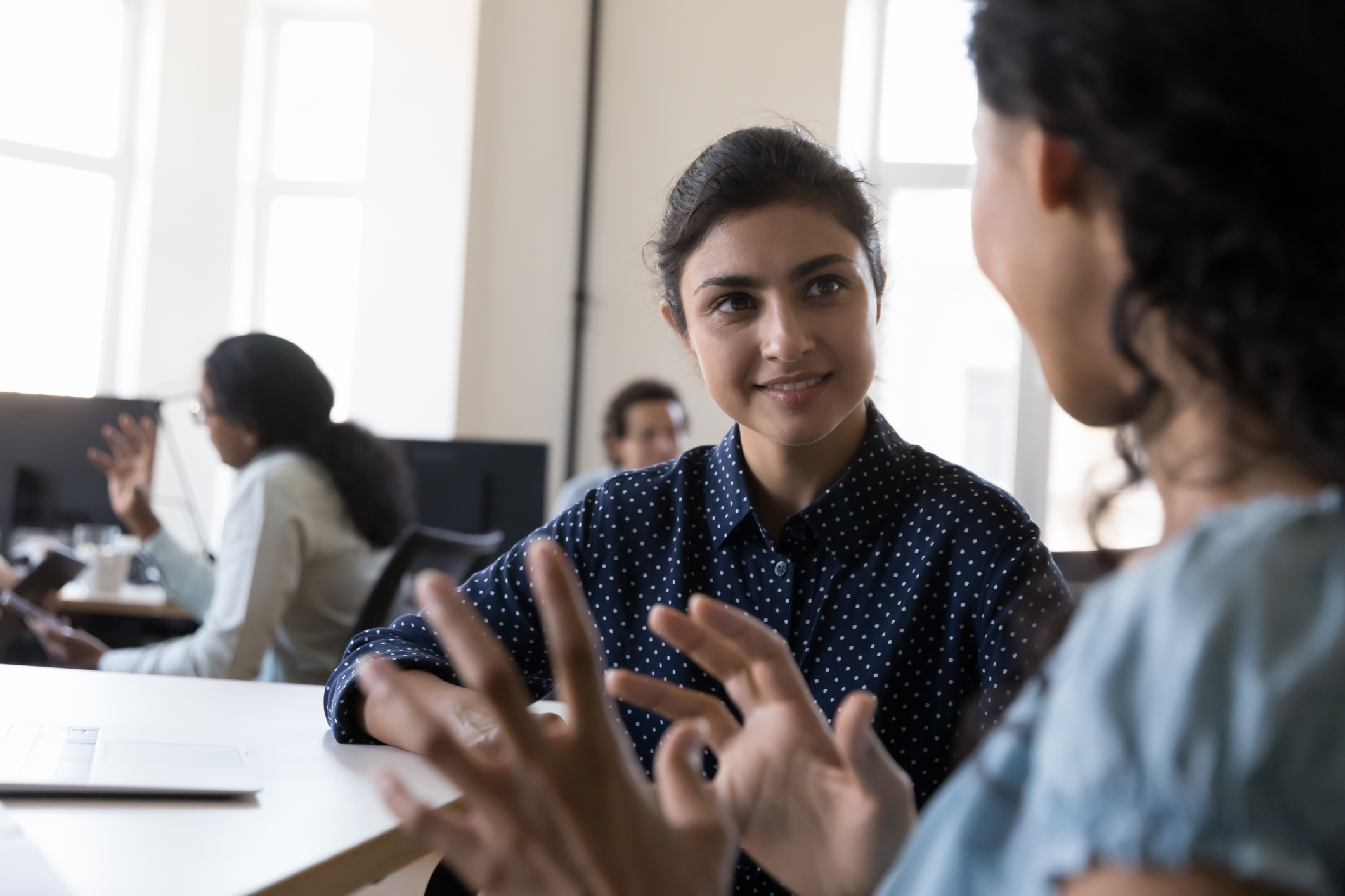 Mentorship Photo of a young student and mentor talking.
